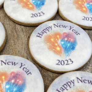 A close up of cookies with happy new year 2 0 2 3 written on them